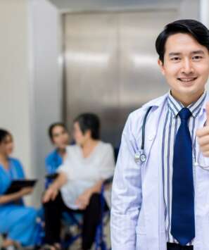 Doctor stands at hospital. Healthcare worker
